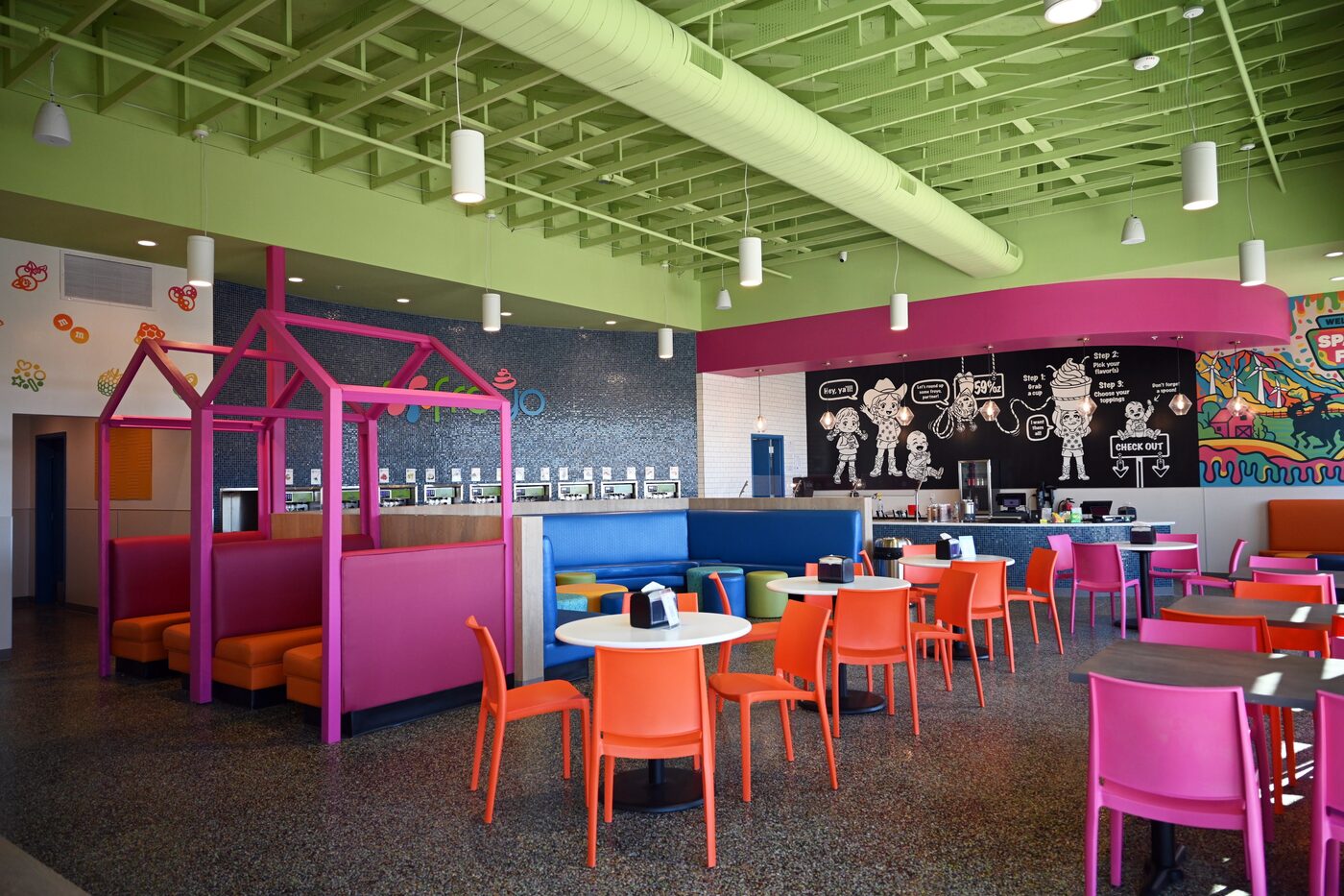 Spanish Fork dining room with green ceiling and pink booths