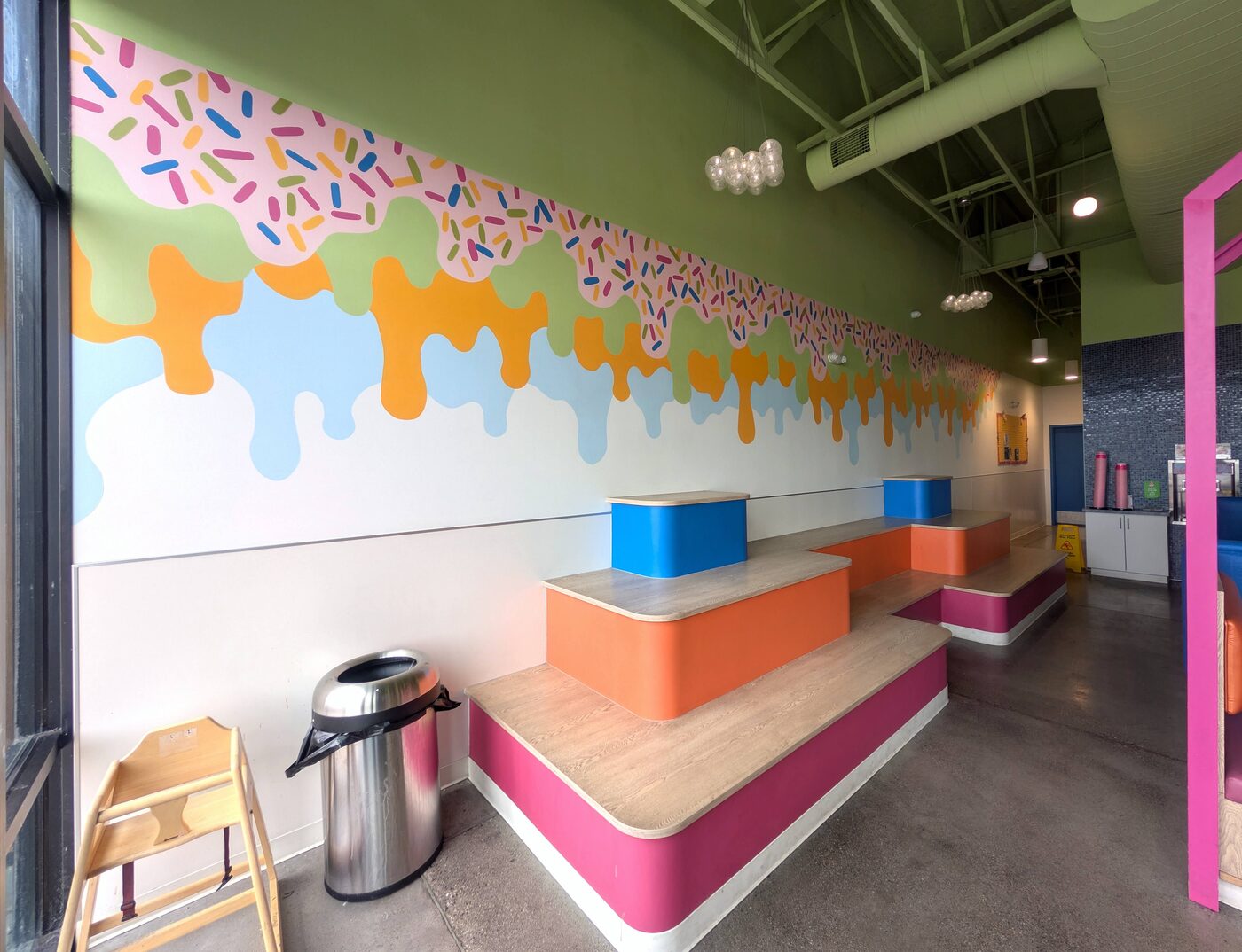 Sprinkle and ice cream drip mural inside Saratoga Springs Froyo