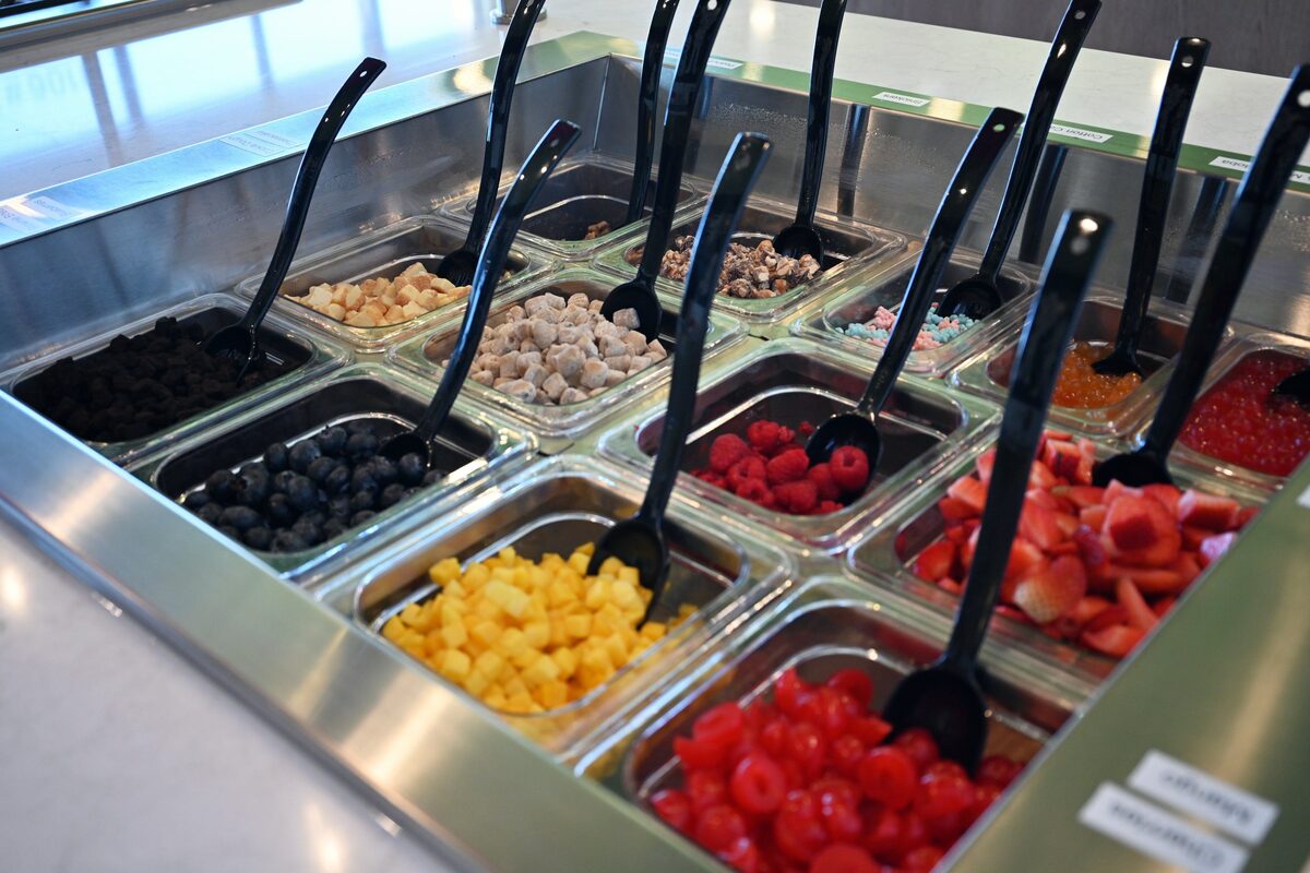 Topping bar packed with fresh fruit, candy, and bobas
